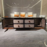 Luxury Coffee Table with Quilted Upholstered Panels Natural Wood Veneer Finish and Stainless Steel Accents